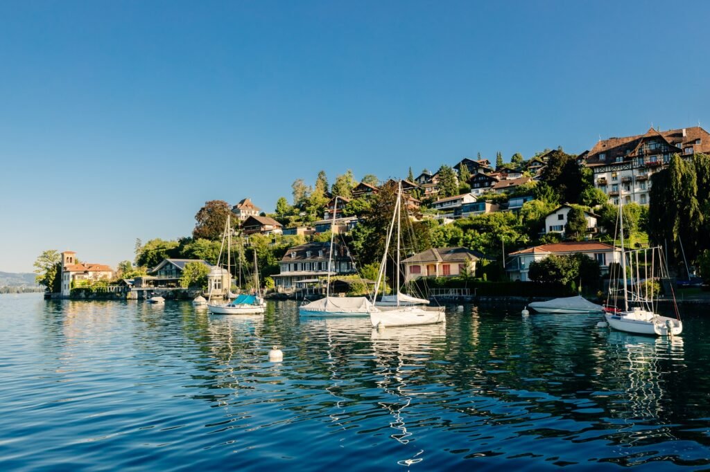 lake with yachts and mountains landscape